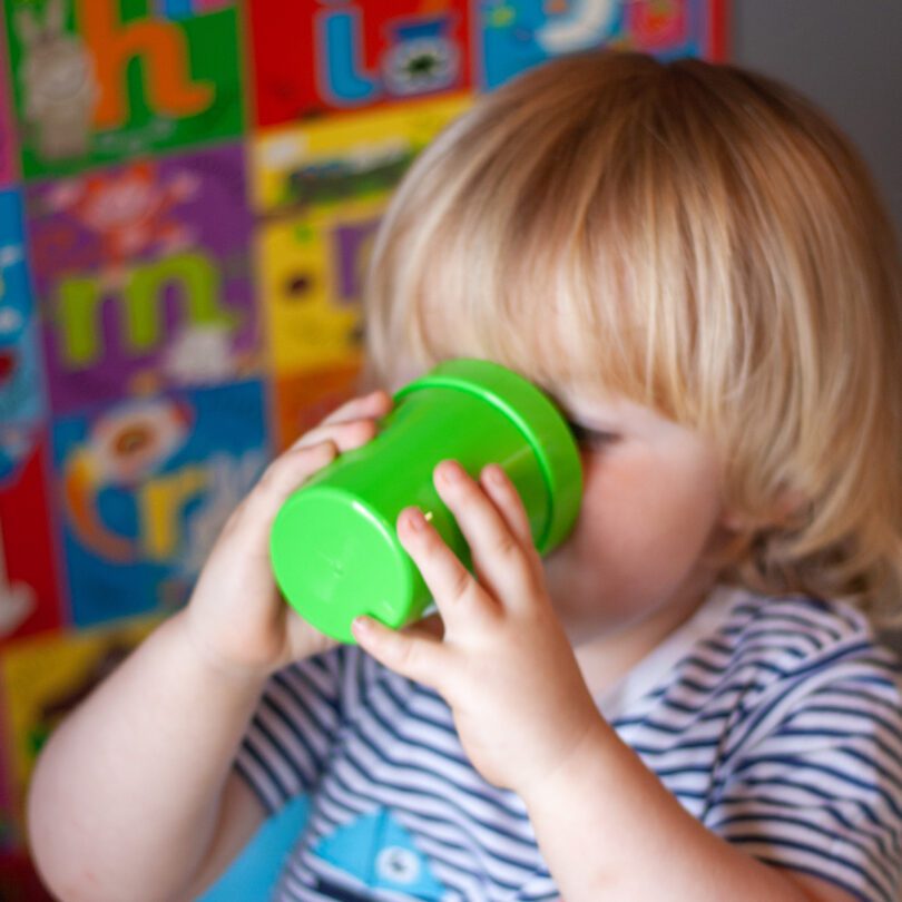 Child Drinking from Green Break Resistant Plastic Tumbler