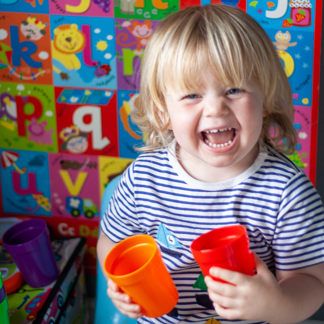 Children's Rainbow Plastic Tumblers in nursery setting