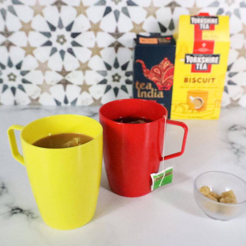 Yellow and Red Beakers with Tea