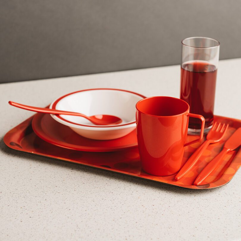 Red Plastic Mug at Dining Setting