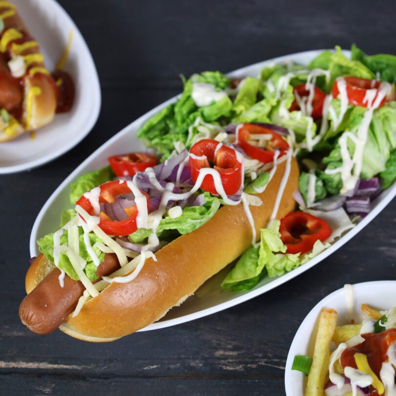 Hot Dog in Large White Oval Dishes