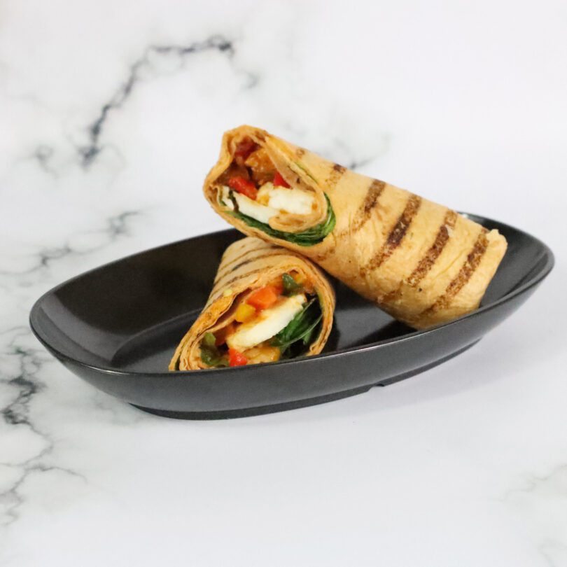 Tortilla Wrap in Medium Odyssey Black Oval Dish