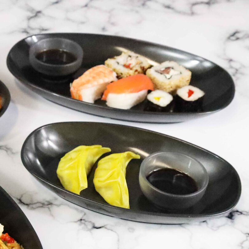 Sushi in Small Odyssey Black Oval Dishes