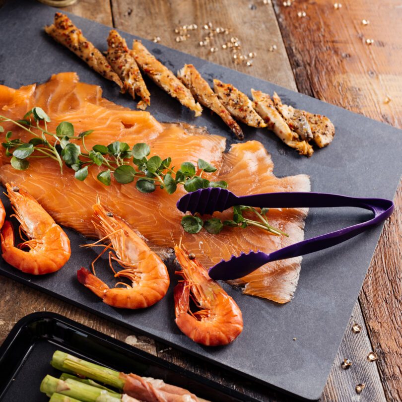 Air Fryer Serving Tongs with an appetizer fish platter