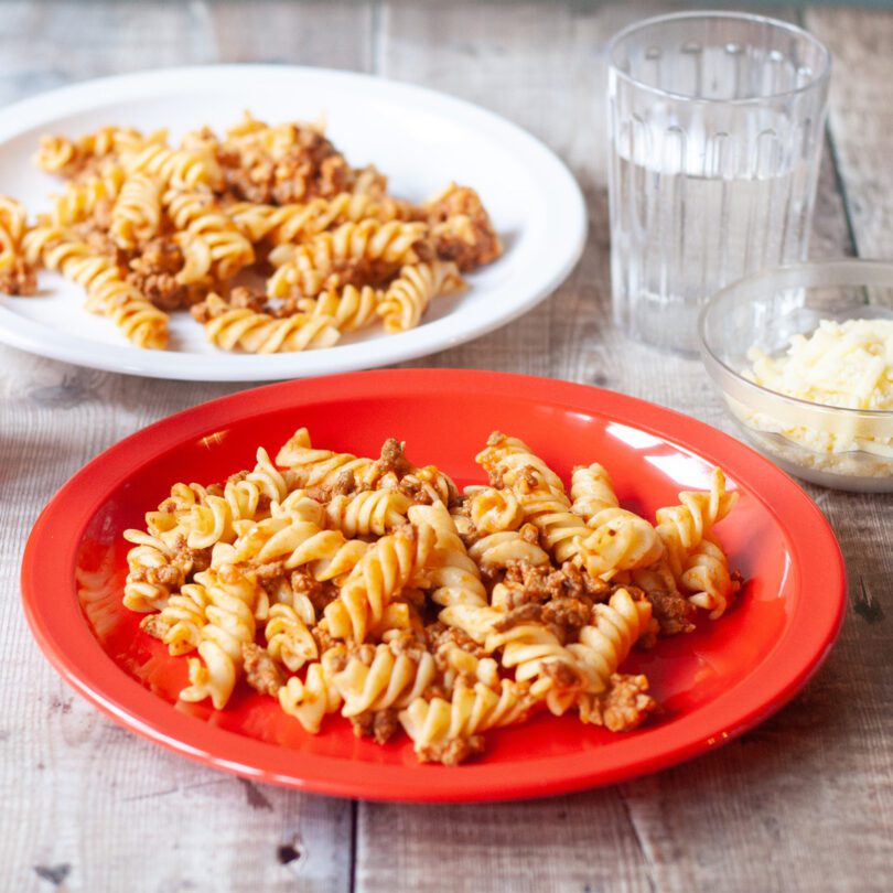 Pasta on Shatterproof Red and White Children's Plates