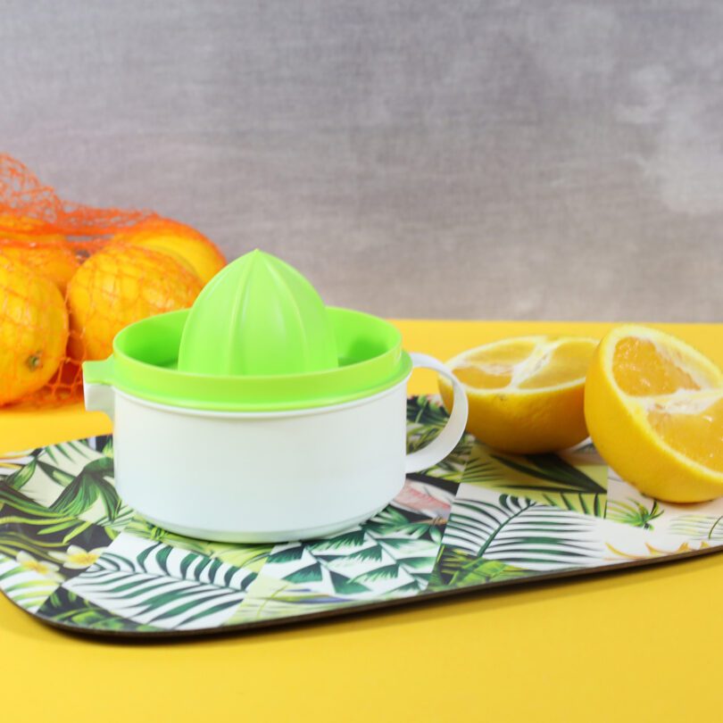 Juicer on Serving Tray with Fresh Oranges