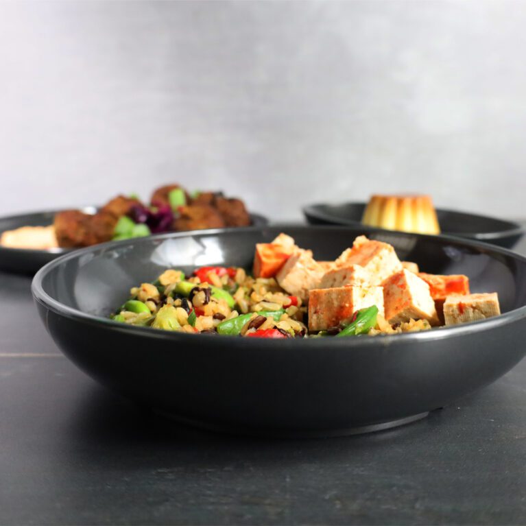 Odyssey Black Walled Bowl with Fusion Food