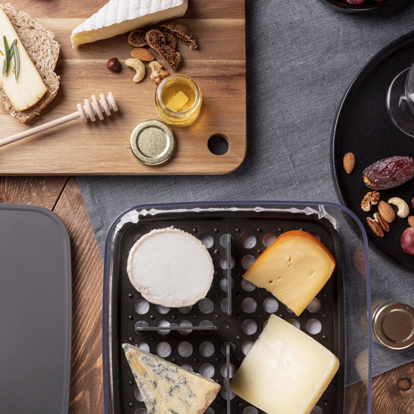 Selection of Speciality Cheeses in Fridge Storage Box