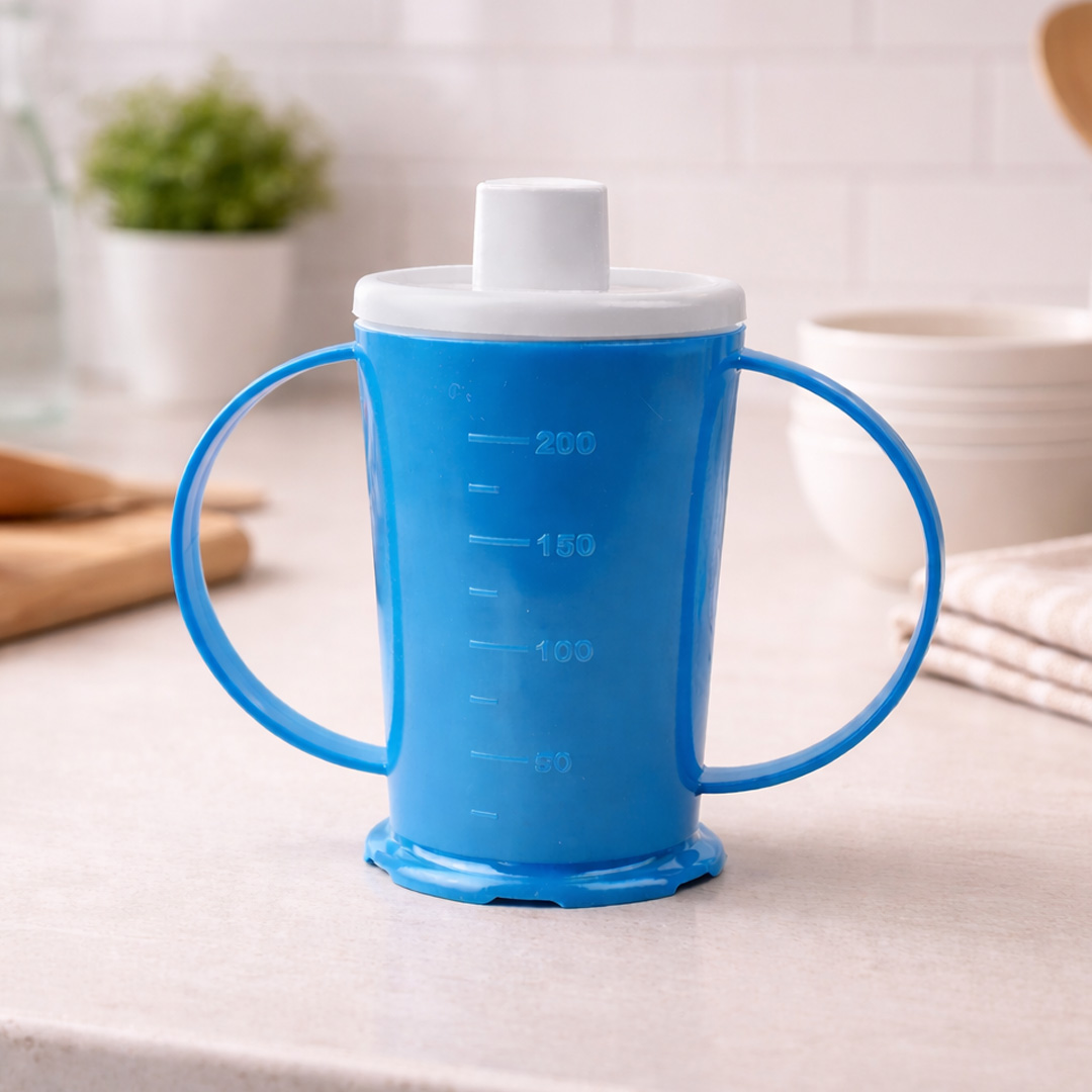 Blue beaker with spout in kitchen setting