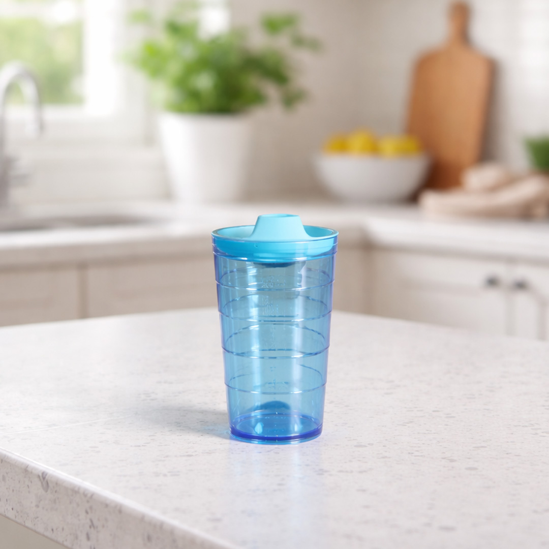 Blue spout on tumbler in kitchen setting