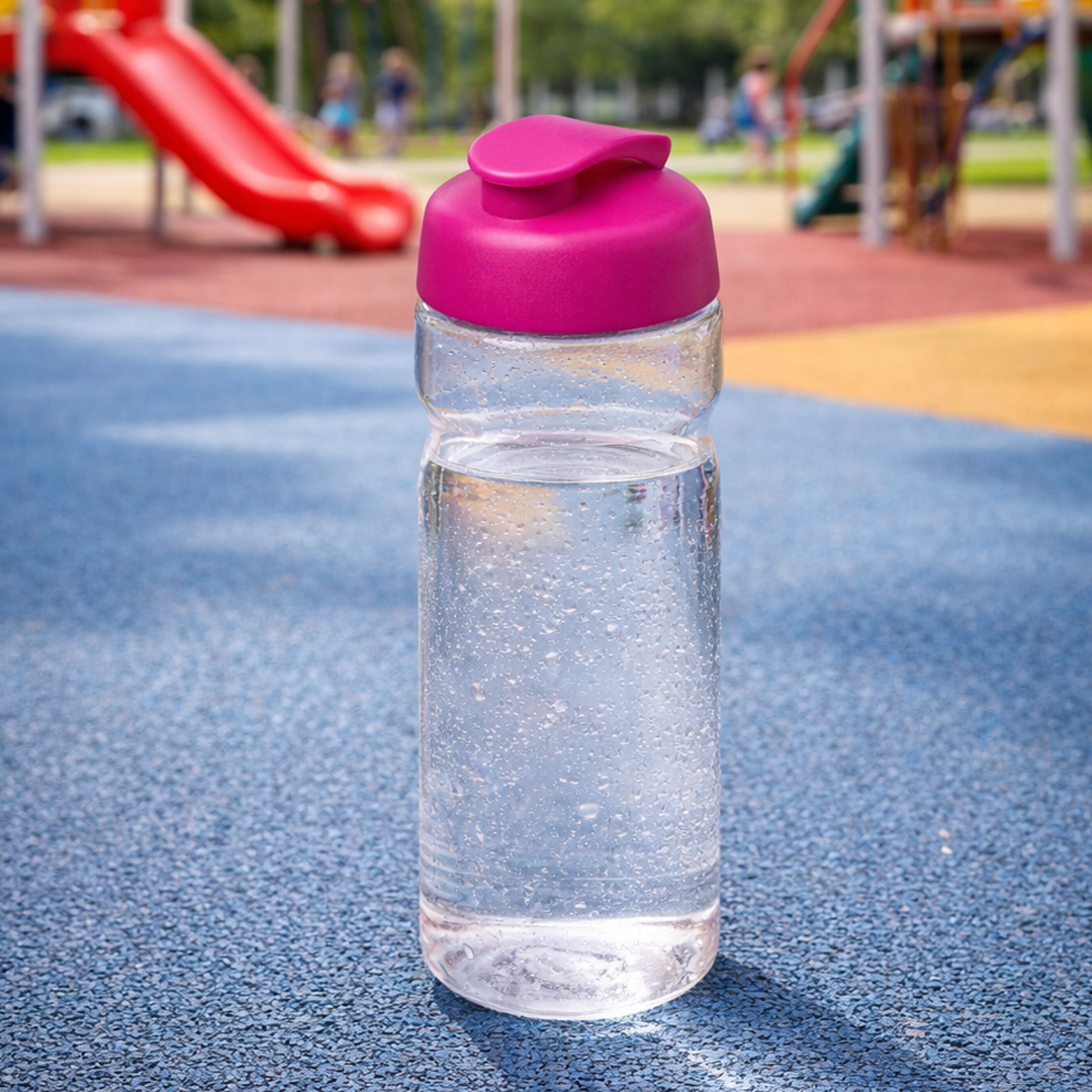 pink water bottle with flip lid in playground setting