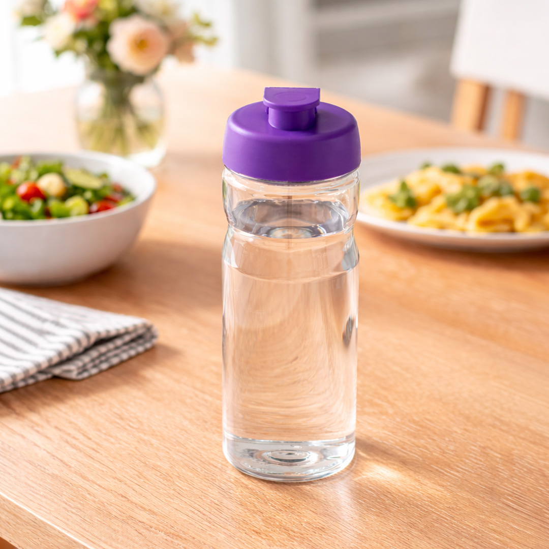 purple water bottle with flip lid on table